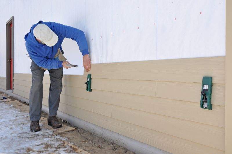 Fiber Cement Siding Being Applied